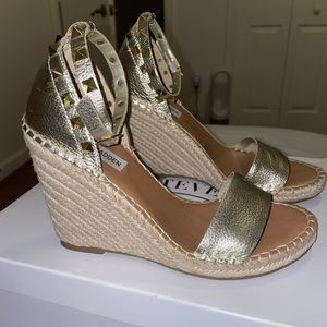 Gold strapped wedge’s